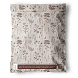 The impack.co Wildflower Biodegradable Mailers 10" x 13" feature a brown floral pattern and recycling notice near the bottom, offering recyclable, eco-friendly packaging. Displayed on a white background.