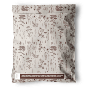 The impack.co Wildflower Biodegradable Mailers 10" x 13" feature a brown floral pattern and recycling notice near the bottom, offering recyclable, eco-friendly packaging. Displayed on a white background.
