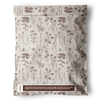 The impack.co Wildflower Biodegradable Mailers 10" x 13" feature a brown floral pattern and recycling notice near the bottom, offering recyclable, eco-friendly packaging. Displayed on a white background.