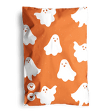 The SALE- Halloween Ghost Pumpkin Biodegradable Mailers 6" x 9" by impack.co feature an orange design with smiling white ghosts—ideal for festive, eco-friendly shipping this Halloween.