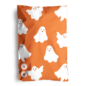 The SALE- Halloween Ghost Pumpkin Biodegradable Mailers 6" x 9" by impack.co feature an orange design with smiling white ghosts—ideal for festive, eco-friendly shipping this Halloween.