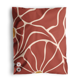 The impack.co Crimson Grove Mailers, on sale at 10" x 13", feature a rust-colored fabric with an abstract beige line pattern and two small round buttons in the corner, ideal for versatile packaging needs.