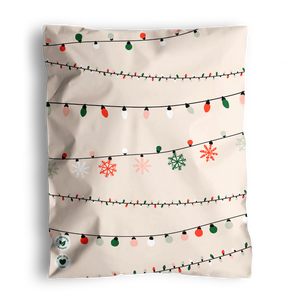 The impack.co SALE - Christmas Light Strings Biodegradable Mailers (10" x 13", US) offer festive, eco-friendly packaging for medium shipments, featuring colorful holiday lights and snowflakes on a beige background.