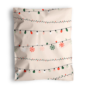 The impack.co SALE Christmas Light Strings Biodegradable Mailers (14.5" x 19", US) feature beige mailers with rows of multicolored Christmas lights and red, green, and white snowflakes—perfect for festive holiday gifting.