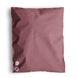 Illustration of a pink fabric swatch with two buttons on impack.co's Copper Rose Leaf Biodegradable Mailers 10" x 13".