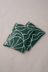 The "SALE - Forest Grove Mailers 10" x 13"" by impack.co features a design with green hues, white wavy lines, and yellow circles on a light background, capturing the fresh aesthetics often desired in versatile packaging.