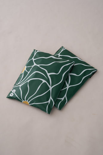 The "SALE - Forest Grove Mailers 10" x 13"" by impack.co features a design with green hues, white wavy lines, and yellow circles on a light background, capturing the fresh aesthetics often desired in versatile packaging.