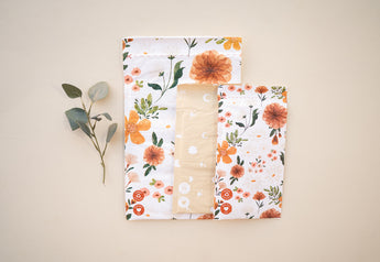 Reusable cloth diapers with a floral pattern packaged in Gardenlumina Padded Paper Mailers 6" x 9" made from FSC-Certified Paper by impack.co.