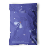 The impack.co Dragonfly Purple Biodegradable Mailers 6" x 9" feature a floral design with white flowers, the text "Leaving Zero Waste Behind," a QR code at the bottom right, and provide plastic-free packaging.
