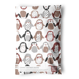 The impack.co Imperfect Penguins Bubble Mailers (6" x 9") are compostable, eco-friendly bags featuring a repeated pattern of penguins in brown, black, and gray with "Leaving Zero Waste Behind" text at the bottom.