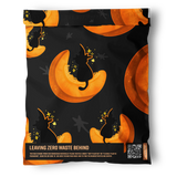 The Halloween Pumpkitties Mailers 19" x 24" by impack.co are black, small shipping bags with orange crescent moons and silhouetted cats. Text at the bottom promotes zero waste and a QR code links to recycling info—great eco-friendly Halloween packaging.