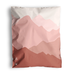 The SALE - Mountain Clay Mailers by impack.co, sized at 10" x 13", feature abstract pink and red mountain-like shapes, providing stylish transit protection for medium-sized shipments.