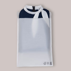 The impack.co Glassine Bags 14.1" x 18.6" display a navy blue garment with a white collar and tie inside, featuring recycle and FSC certification logos—ideal eco-friendly packaging for shipping clothing.