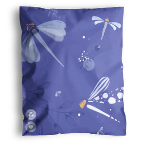 The impack.co Dragonfly Purple Biodegradable Mailers (6" x 9") feature a dragonfly design with abstract dots and plant motifs in shades of purple and white, delivered in eco-friendly, sustainable packaging.