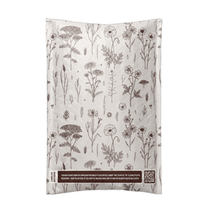The impack.co Wildflower Biodegradable Bubble Mailers 6" x 9" feature botanical wildflower prints, a QR code, and usage instructions—perfect for protecting fragile items during shipping.