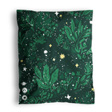 Green scarf with a botanical and celestial pattern, displayed flat in impack.co's Midnight Lush Mailer 14.5" x 19".
