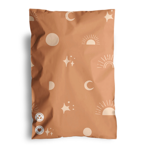 The impack.co SALE - Celestial Tan Mailers 6" x 9" CA features a stylish brown design with celestial tan prints of suns, moons, and stars, along with two circular symbols on the bottom left corner, making them perfect for transit protection.