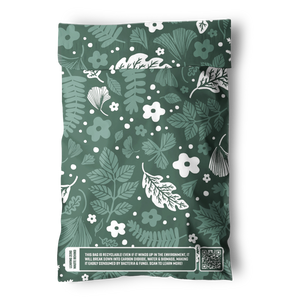 The impack.co Emerald Evergreen Biodegradable Mailers 6"x9" feature white botanical patterns, a printed sustainability message, and a QR code—ideal for those seeking eco-friendly, plastic-free packaging or compostable mailers.