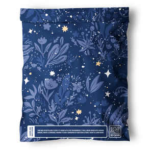The Midnight Indigo Mailers 10" x 13" by impack.co come in a resealable blue bag with floral and star designs; the bottom label highlights eco-friendly, recyclable packaging and features a QR code.