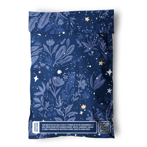 The impack.co Midnight Indigo Mailers 6" x 9" are blue, recyclable bags with floral and star patterns, perfect for shipping small accessories or jewelry. A sustainability message and QR code are printed near the bottom.