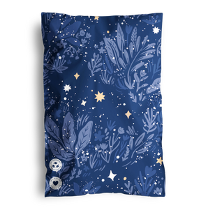 The decoratively adorned "SALE - Midnight Indigo Mailers 6\" x 9\"" by impack.co features sustainable dark blue fabric with leaf, star, and flower motifs in lighter hues. Two circular labels at the bottom left enhance its charm.