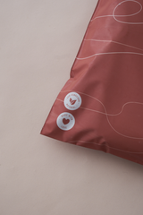 The SALE Tidal Terracotta Mailers from impack.co are red with white text and buttons, showcasing "Made with love" and "100% compostable material." These mailers provide an elegant, eco-friendly packaging option for the modern, conscientious consumer.