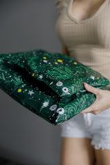 A woman holding a Midnight Lush Mailers 14.5" x 19" bag from impack.co.
