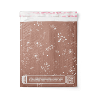 Back view of a Rosy Brown Biodegradable Bubble Mailers 6" x 9" with a floral design on it from impack.co.