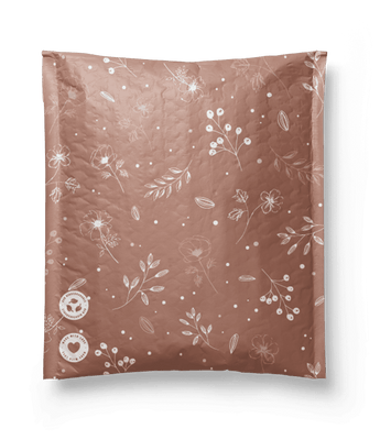 A Rosy Brown Biodegradable Bubble Mailer 6" x 9" with a floral pattern on it from impack.co.